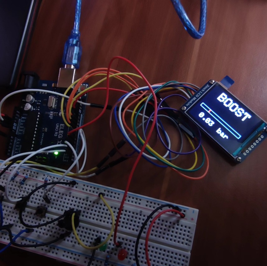Montage sur breadboard avec Arduino Uno et écran OLED affichant « BOOST »
